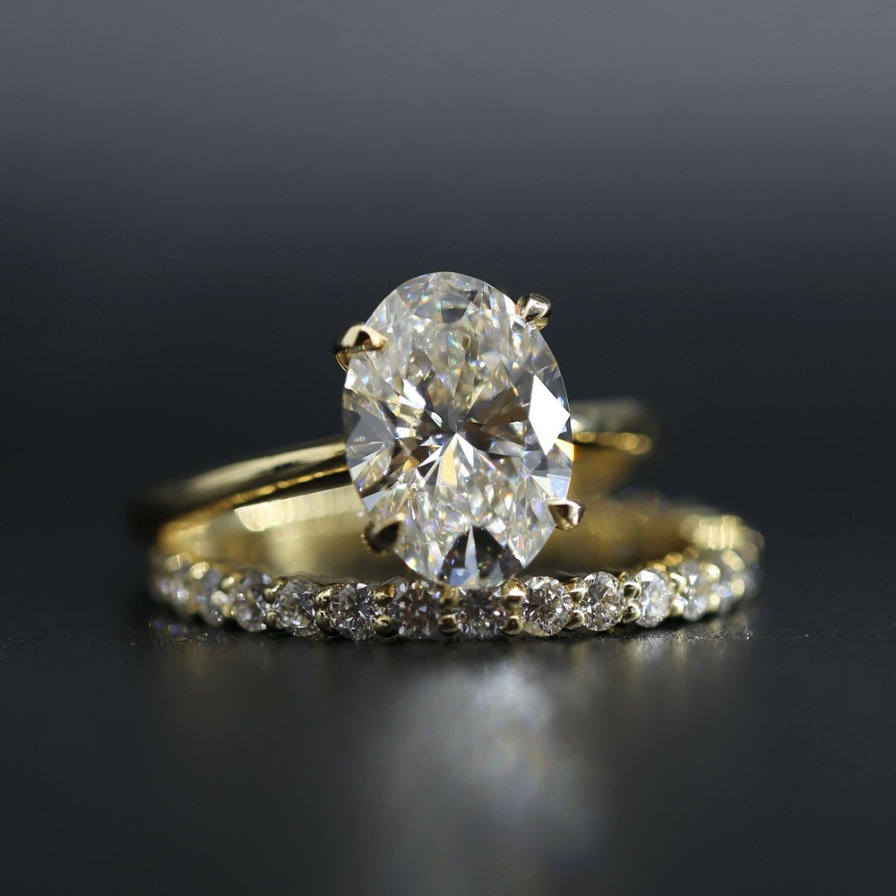3 carat oval diamond ring and a wedding band